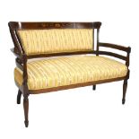 An Edwardian inlaid mahogany settee raised on column supports, width 118cm.
