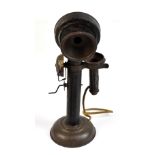 A toy tin pillar telephone, height 22cm.