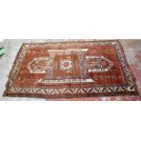 A 20th century Caucasian red ground rug, 279 x 163cm.Additional InformationCleaned, restored and