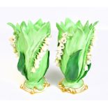 ATTRIBUTED TO COALPORT; a pair of lily of the valley green glazed gilt heightened vases, unmarked,