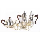 ADIE BROS LTD; a George V five piece hallmarked silver tea service, each piece with filigree