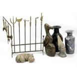 A brass miniature model of a stand with various martial arts weapons, width 35cm, a soapstone