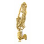 An 18ct yellow gold fine link chain, approx 2.3g, supporting a yellow metal cockerel stamped 22k