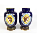 VIERZON; a pair of faience cobalt blue ground vases with gilt metal bases and lozenge shaped profile