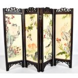 A small 20th century Chinese four panel folding screen set with painted panels depicting cats,