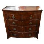 A Victorian mahogany bowfronted chest of two short over three long drawers, raised on bracket