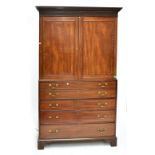 A good George III mahogany boxwood strung secrétaire press cupboard, the moulded dentil cornice