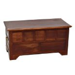 A reproduction mahogany seven drawer chest modelled as a blanket chest, raised on bracket feet,