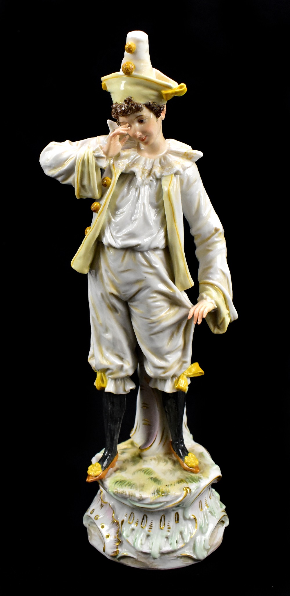 MEISSEN; a 19th century figure of a clown, blue painted crossed swords mark to base, also incised