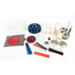 A group of railway lamp spare parts to include blue lenses, a red lens, a large clear lens, a B.R.