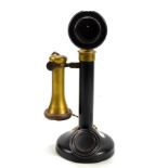 A brass mounted candlestick telephone, height 30cm.