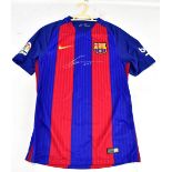 LIONEL MESSI; a signed replica Barcelona shirt.
