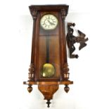 A 19th century mahogany cased Vienna wall clock, the circular dial set with Roman numerals and
