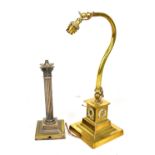 An early 20th century brass adjustable table lamp on square plinth base with relief rococo style