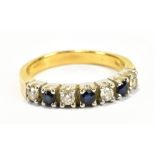 An 18ct yellow gold seven stone diamond and sapphire ring, size T, approx 6.1g.