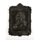 A William IV bronze profile bust plaque depicting William Shakespeare within a floral decorated