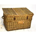 A vintage metal bound wicker laundry basket with rope twist handles, length 97cm.
