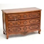 A mahogany three-drawer chest of serpentine outline with reeded detail to front corners, approx 84 x