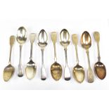 A group of nine 19th century hallmarked silver Fiddle pattern dessert spoons, some with engraved