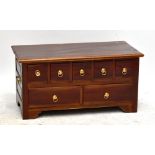 A reproduction seven drawer chest, raised on bracket feet.Additional InformationGeneral surface