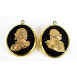 A pair of 19th century profile busts set in oval brass frames, the first depicting William