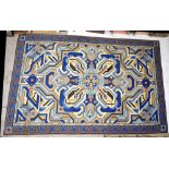A large needlepoint geometric design rug, monogrammed AB and dated 1976, 394 x 259cm.