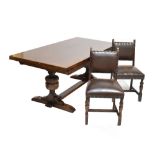 A mid-20th century dark oak dining suite comprising draw leaf refectory table, raised on carved