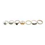 Seven dress rings to include two 9ct yellow gold examples (af), approx 2.5g, and a silver example (