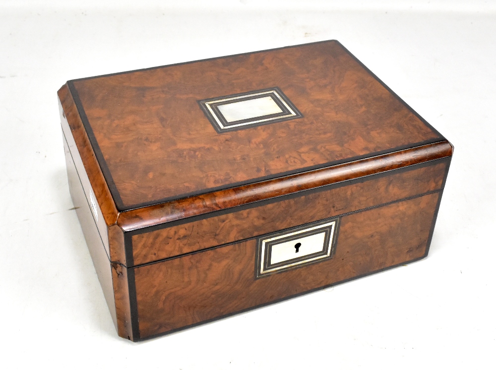 A Victorian burr walnut rectangular sewing box, the cover inlaid with a mother of pearl panel