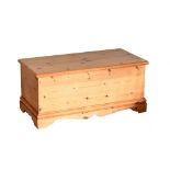 A modern pine blanket box with hinged lid, width 95cm.