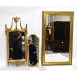 A reproduction gilt framed rectangular wall mirror with urn surmount, height 116cm, and two
