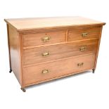 An early 20th century walnut chest of two short over two long drawers, width 122cm.