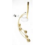 A contemporary five branch brass effect floor lamp on circular marble base.