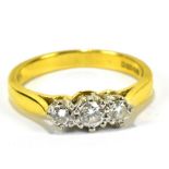 An 18ct yellow gold three stone diamond ring, size H to I, approx 2.8g.