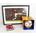 A signed photograph of Ruud Van Nistelrooy, a Manchester United signed football and a DVD collection