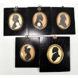 Five 19th century silhouettes depicting lady and four gentlemen, four identified verso as members of