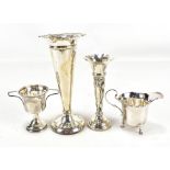 Four variously hallmarked silver items comprising two spill vases with loaded bases, a George VI