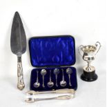 A small group of hallmarked silver comprising a pair of Victorian sugar tongs, London 1838, a twin