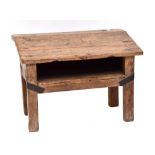 A rustic elm child's low desk with sloping front, width 54cm.