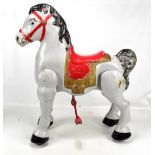 A vintage painted metal child's sit on horse, height 78cm.