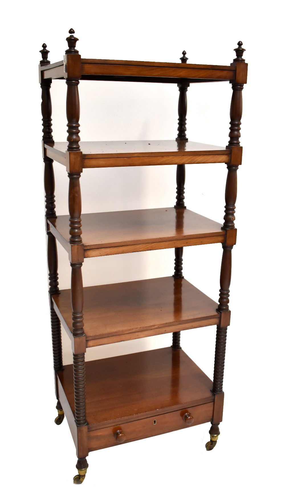 A William IV mahogany five-tier whatnot with baluster and bobbin-turned uprights, frieze drawer and