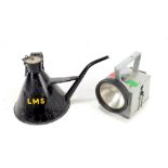 A black L.M.S oil can and a B.R. hand held battery operated inspection torch (2).