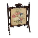 An early 20th century mahogany framed fire screen with tapestry inset panel, height 76cm.
