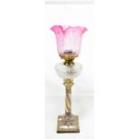 A Victorian electroplated Corinthian column oil lamp with floral swag decoration, height 78cm.