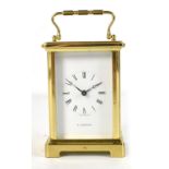 DUVERDREY & BLOQUEL OF FRANCE; a brass cased carriage clock retailed by H. Samuel, the dial set with