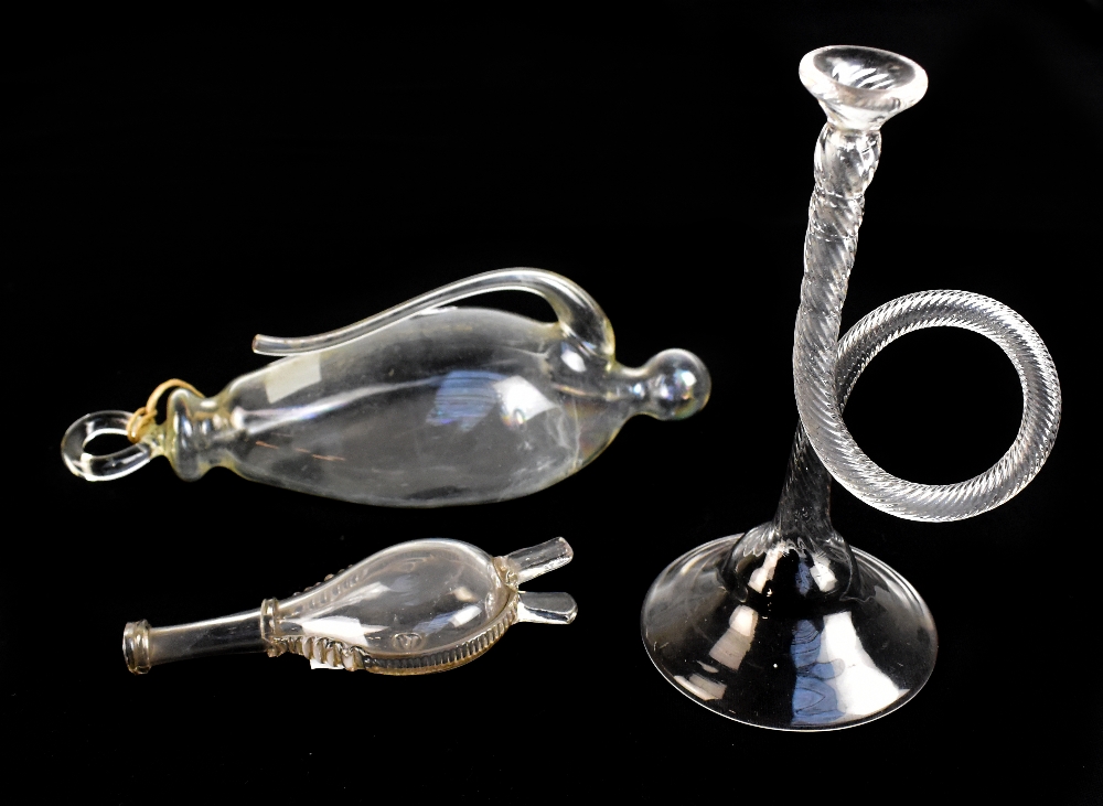 A 19th century French clear glass barometer, a novelty glass horn and a novelty glass flask in the