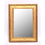 A rectangular gilt framed bevelled wall mirror, 91 x 68cm.