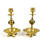 A pair of Aesthetic Movement brass and glass candlesticks, height 19.5cm.
