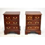 A pair of reproduction mahogany bedside chests, each with two short over two long drawers raised