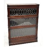 GLOBE WERNICKE; a mahogany three tier bookcase with leaded glazed doors, height 115cm.